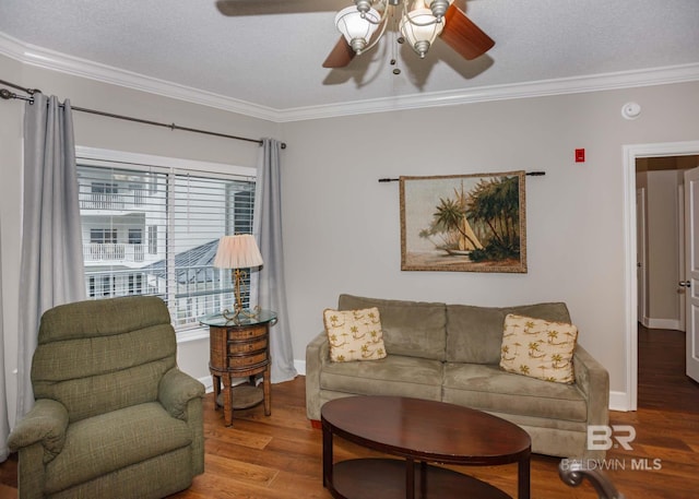 22984 Perdido Beach Blvd Unit A23, Orange Beach, AL 36561 - living area featuring a ceiling fan, ornamental molding, wood finished floors, a textured ceiling, and baseboards