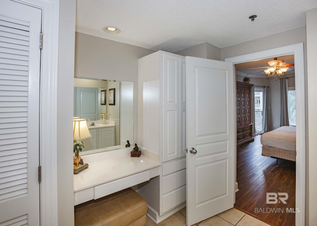 22984 Perdido Beach Blvd Unit A23, Orange Beach, AL 36561 - bathroom featuring vanity, tile patterned floors, connected bathroom, recessed lighting, and a ceiling fan