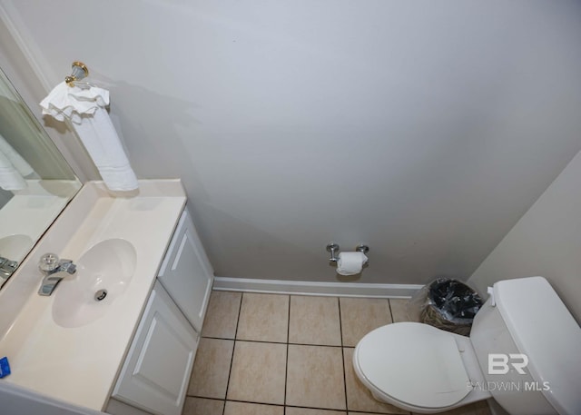 22984 Perdido Beach Blvd Unit A23, Orange Beach, AL 36561 - half bathroom featuring vanity, toilet, tile patterned floors, and baseboards