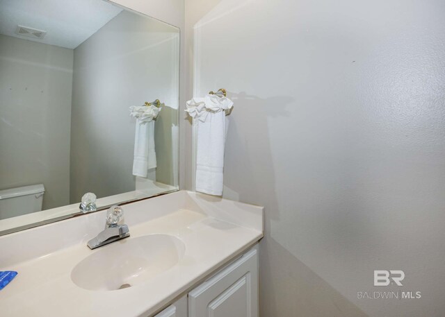 22984 Perdido Beach Blvd Unit A23, Orange Beach, AL 36561 - bathroom featuring vanity and toilet