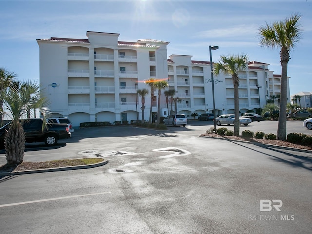 22984 Perdido Beach Blvd Unit A23, Orange Beach, AL 36561 - view of apartment building / complex featuring uncovered parking