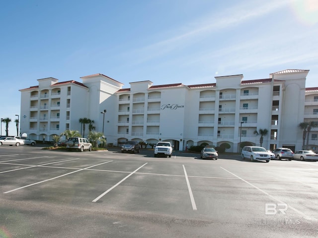 22984 Perdido Beach Blvd Unit A23, Orange Beach, AL 36561 - view of apartment building / complex featuring uncovered parking