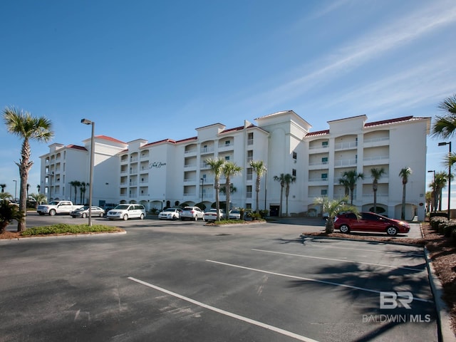 22984 Perdido Beach Blvd Unit A23, Orange Beach, AL 36561 - view of apartment building / complex featuring uncovered parking