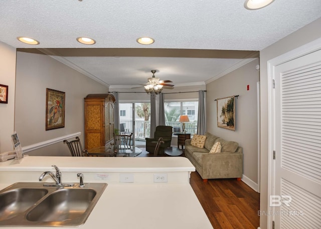 22984 Perdido Beach Blvd Unit A23, Orange Beach, AL 36561 - kitchen with a sink, dark wood-style flooring, crown molding, a textured ceiling, and recessed lighting