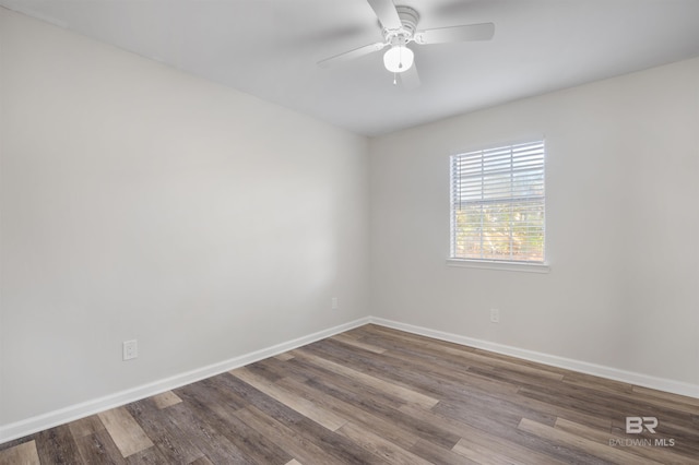 spare room featuring hardwood / wood-style flooring and ceiling fan