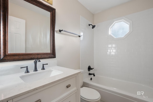 full bathroom with vanity, toilet, and tiled shower / bath