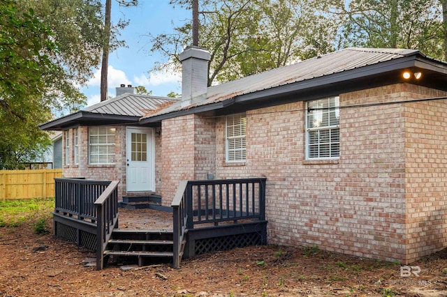 rear view of property with a deck