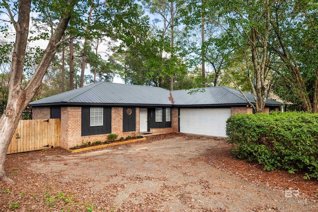 single story home with a garage