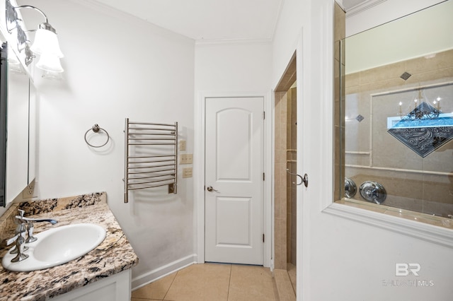 bathroom with crown molding, vanity, radiator heating unit, and tile patterned floors