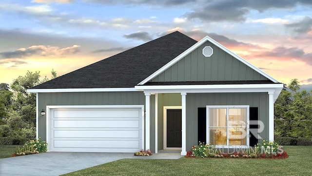 view of front facade with a lawn and a garage