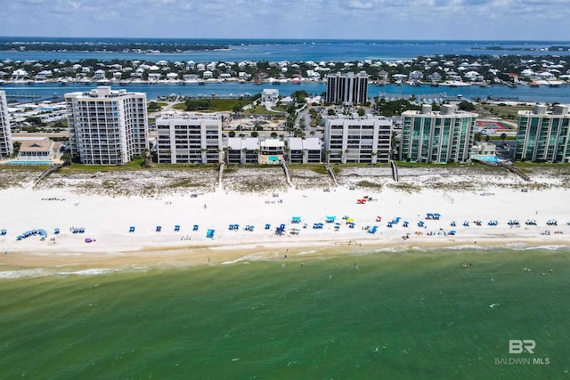 birds eye view of property with a view of the beach and a water view