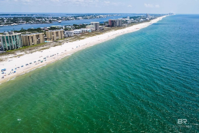 bird's eye view featuring a city view, a water view, and a beach view