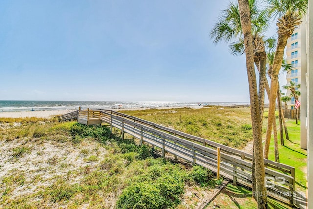 view of yard featuring a water view and fence