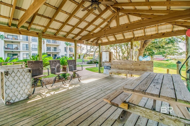 wooden terrace featuring a yard