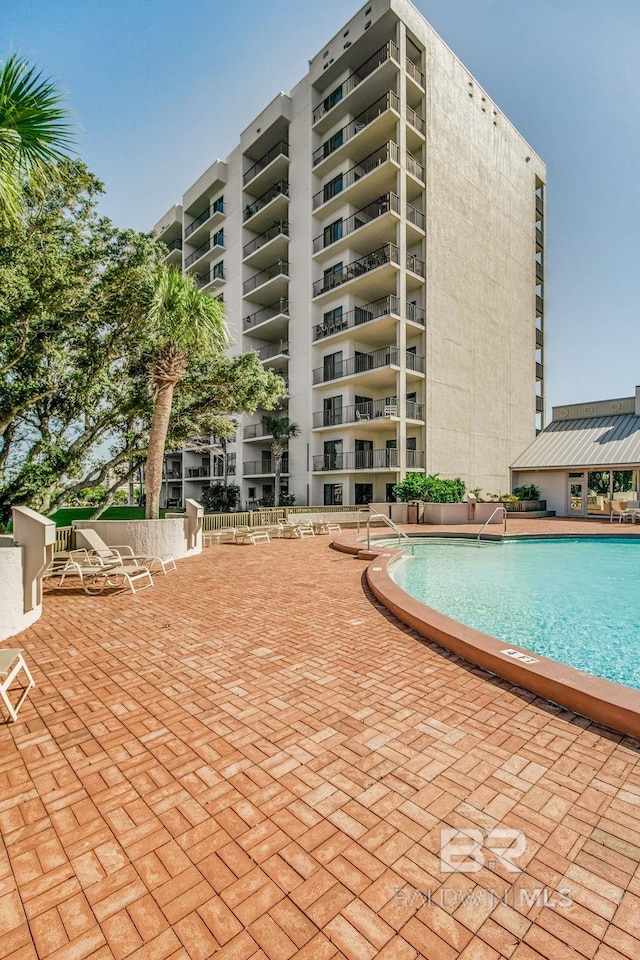 pool featuring a patio area