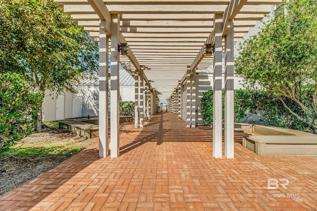 view of patio / terrace featuring fence and a pergola