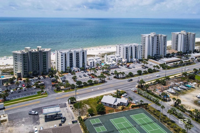 birds eye view of property featuring a water view and a city view