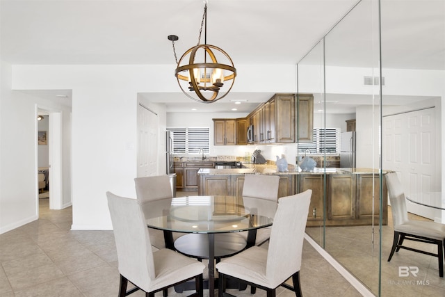 dining space featuring light tile patterned floors, recessed lighting, visible vents, an inviting chandelier, and baseboards