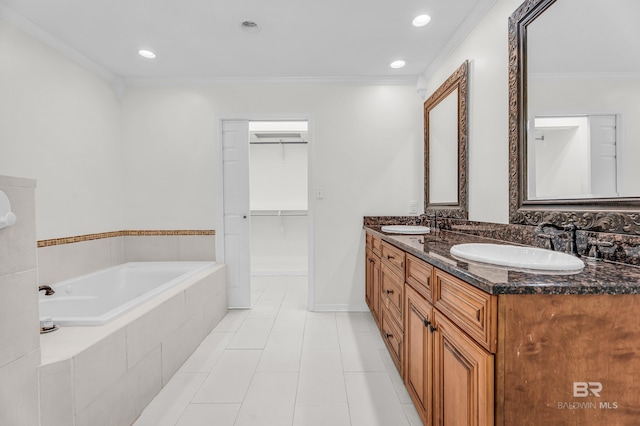 566 Stuart St, Daphne, AL 36526 - bathroom with double vanity, crown molding, a bath, tile patterned flooring, and recessed lighting