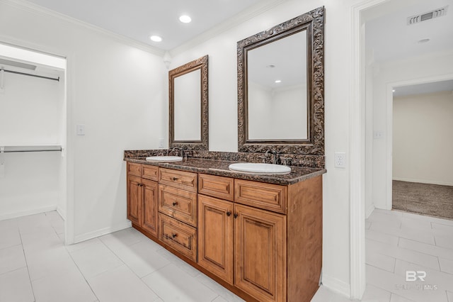 566 Stuart St, Daphne, AL 36526 - bathroom with double vanity, ornamental molding, baseboards, and recessed lighting