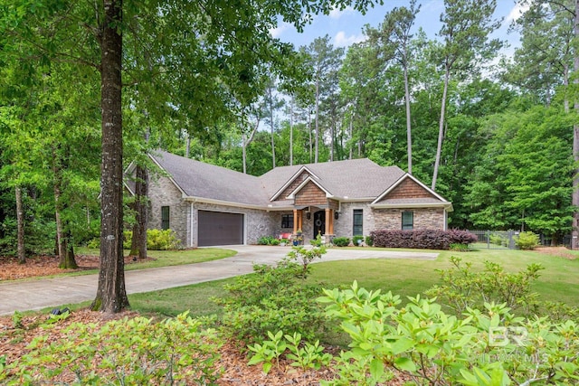 3250 Riviere Du Chien Rd, Mobile, AL 36693 - view of front of home with a front lawn, concrete driveway, a garage, and roof with shingles