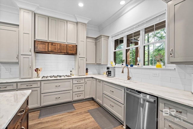 3250 Riviere Du Chien Rd, Mobile, AL 36693 - kitchen with dishwasher, crown molding, gray cabinets, a sink, and white gas stovetop