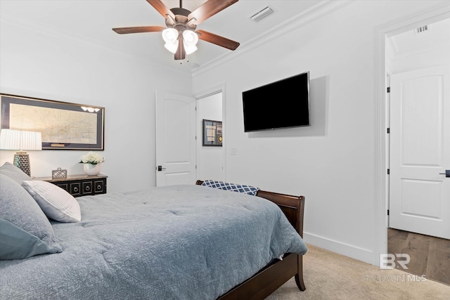 3250 Riviere Du Chien Rd, Mobile, AL 36693 - carpeted bedroom with crown molding, baseboards, and a ceiling fan