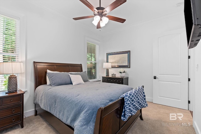 3250 Riviere Du Chien Rd, Mobile, AL 36693 - bedroom with crown molding, multiple windows, light colored carpet, a ceiling fan, and baseboards