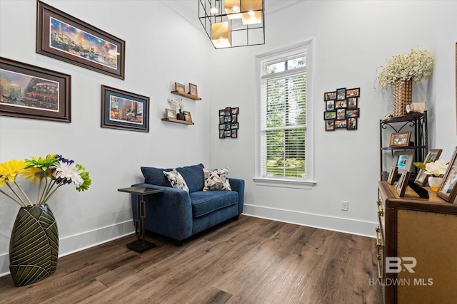 3250 Riviere Du Chien Rd, Mobile, AL 36693 - living area featuring dark wood-type flooring, baseboards, a chandelier, and healthy amount of natural light