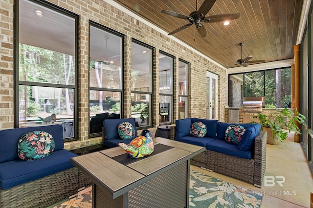 3250 Riviere Du Chien Rd, Mobile, AL 36693 - sunroom / solarium with ceiling fan, an outdoor kitchen, and an outdoor hangout area