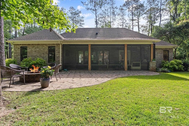 3250 Riviere Du Chien Rd, Mobile, AL 36693 - back of property with an outdoor fire pit, a patio area, a lawn, and a shingled roof