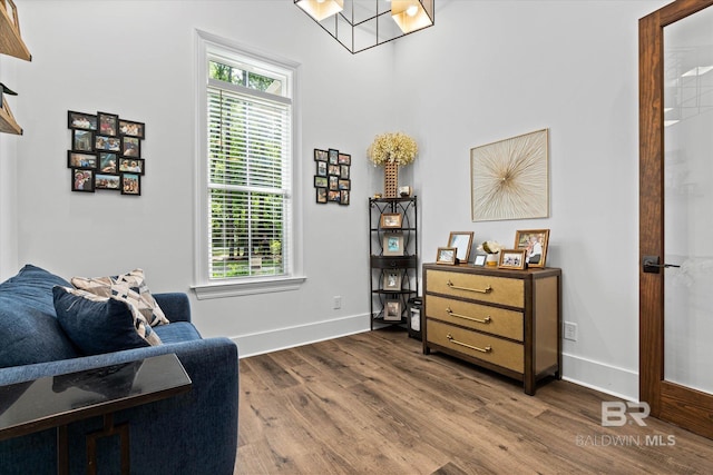 3250 Riviere Du Chien Rd, Mobile, AL 36693 - living area with dark wood-type flooring, baseboards, and a chandelier