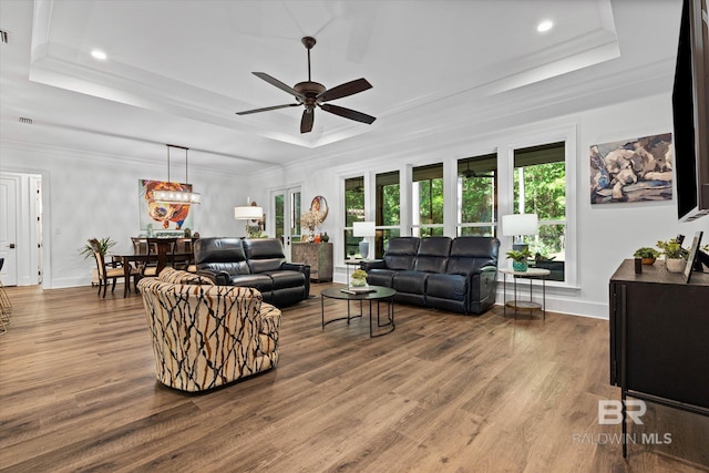 3250 Riviere Du Chien Rd, Mobile, AL 36693 - living room featuring a tray ceiling, ceiling fan, wood finished floors, recessed lighting, and baseboards
