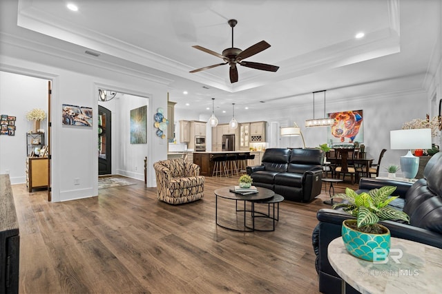 3250 Riviere Du Chien Rd, Mobile, AL 36693 - living room with a tray ceiling, ceiling fan, dark wood finished floors, recessed lighting, and ornamental molding
