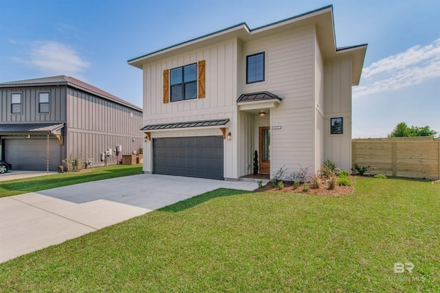 view of front facade featuring a front yard and a garage