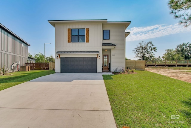 view of front facade featuring a front lawn and a garage