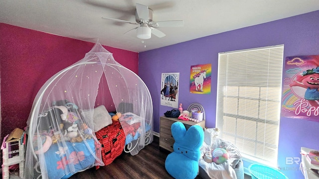 bedroom featuring dark wood finished floors and a ceiling fan