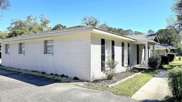 view of home's exterior featuring brick siding