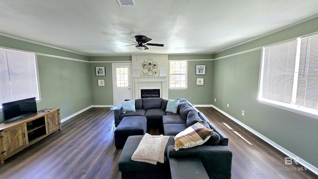 living room featuring dark wood-type flooring, a fireplace, and baseboards