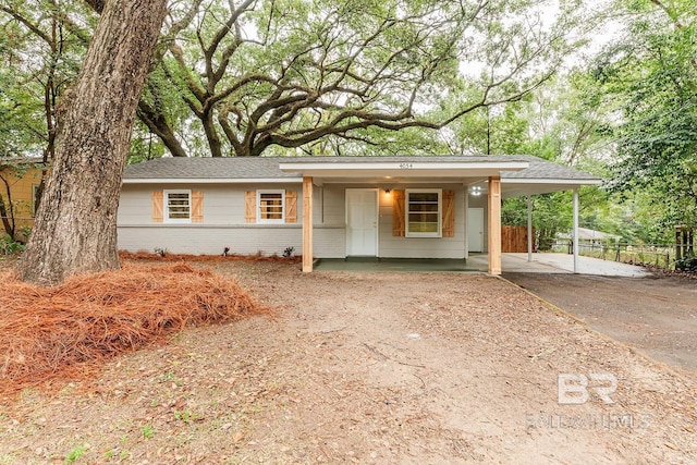 ranch-style home with a carport