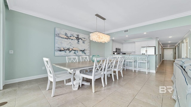 26688 Perdido Beach Blvd Unit 1203, Orange Beach, AL 36561 - dining area with crown molding, a chandelier, recessed lighting, and light tile patterned flooring