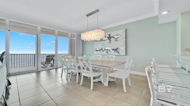 26688 Perdido Beach Blvd Unit 1203, Orange Beach, AL 36561 - dining space featuring a chandelier, light tile patterned floors, crown molding, and recessed lighting