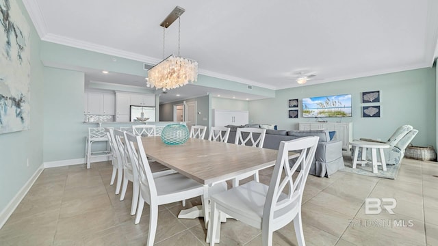 26688 Perdido Beach Blvd Unit 1203, Orange Beach, AL 36561 - dining space featuring crown molding, a chandelier, and light tile patterned floors