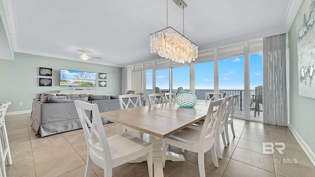 26688 Perdido Beach Blvd Unit 1203, Orange Beach, AL 36561 - dining area featuring ornamental molding, light tile patterned flooring, plenty of natural light, a chandelier, and a ceiling fan