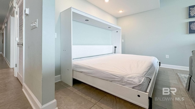 26688 Perdido Beach Blvd Unit 1203, Orange Beach, AL 36561 - bedroom featuring tile patterned floors and recessed lighting