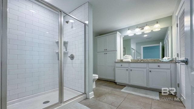 26688 Perdido Beach Blvd Unit 1203, Orange Beach, AL 36561 - bathroom with a shower stall, tile patterned floors, and vanity