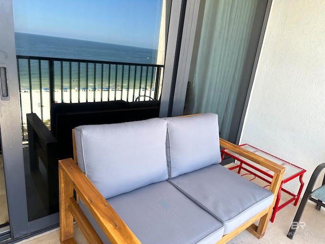 balcony with a beach view and a water view