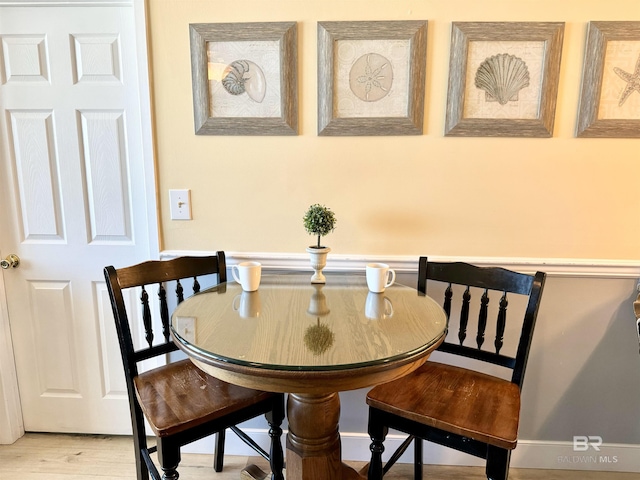 dining area with light wood-style flooring