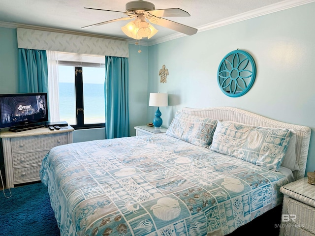 carpeted bedroom with a ceiling fan and crown molding