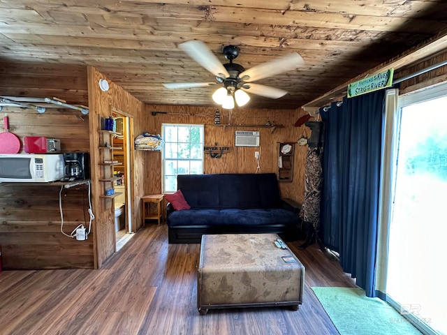 unfurnished living room with ceiling fan, a wall mounted air conditioner, dark hardwood / wood-style floors, wooden walls, and wood ceiling